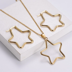 Polished gold stainless steel jewelry set featuring hollow star pendant and hoop earrings