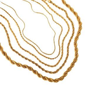 Layered golden twisted rope chain necklaces in various lengths on white background