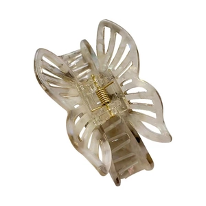 Elegant translucent cream butterfly hair claw with marble texture and golden spring
