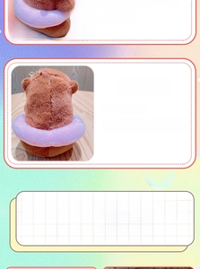 Rear view of a brown plush capybara keychain with a pink purple swim ring and metal hook