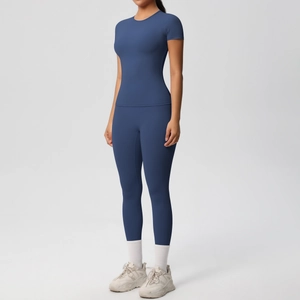 Detail of navy blue two-piece athletic set with high-waisted leggings and fitted t-shirt