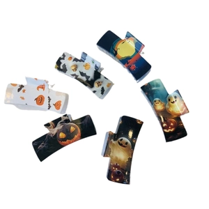 Set of 6 Halloween hair claws featuring pumpkin ghost bat and skull designs