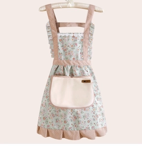 Floral cotton apron detail featuring polka dot patterns, ruffled edges and a large front pocket