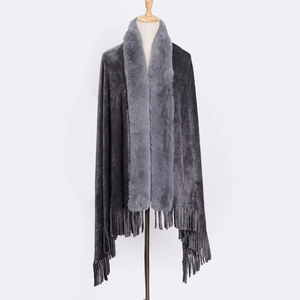 Detail of dark grey flannel shawl with faux rabbit fur collar and fringed hem design