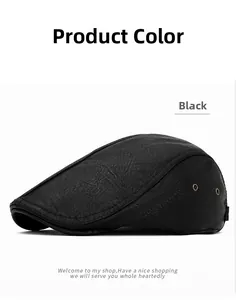 Close-up of black leather flat cap showing lychee grain texture and side metal eyelets