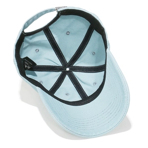 Detailed interior of light blue cotton baseball cap with reinforcing tape and sweatband