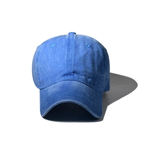 Detailed front view of navy blue washed cotton baseball cap with curved visor and retro finish