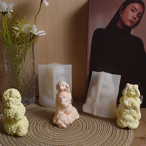 Macro detail of stacked sheep dog cat silicone molds and resin animal figurines