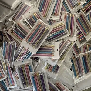 Bulk packs of glitter ballpoint pens featuring funny weekday quotes in transparent bags