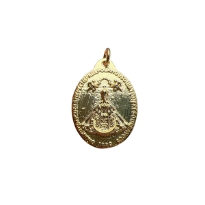 Golden Virgin Mary Guadalupe pendant with embossed details and zircon on white background