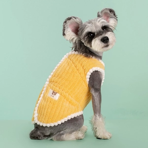 Cozy yellow fleece pet vest for dogs featuring a cute bear patch on a mint green background