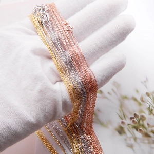 Detailed view of S925 sterling silver necklaces in gold, silver, and rose gold finishes