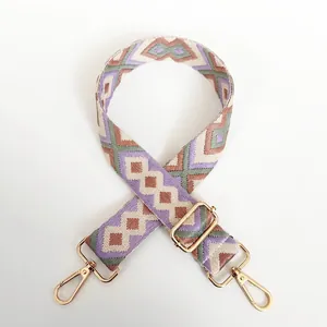 Detail of No.10 purple geometric jacquard bag strap with gold metal hooks and hardware