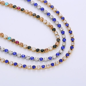 Detailed macro shot of stainless steel tennis chain bracelets with colorful zircon stones