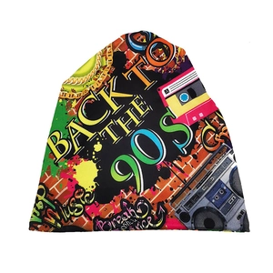 Detail of 90s retro hip-hop beanie with boombox, cassette and graffiti prints