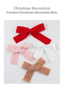 Close-up of fuzzy teddy fleece Christmas bows in red, pink, white and brown colors