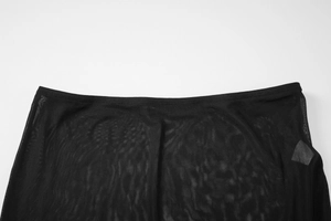 Close-up of black sheer mesh fabric texture on hollow back halter dress skirt set