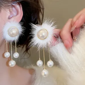 Elegant long tassel earrings with white fur balls and pearls for autumn and winter