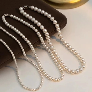 French vintage pearl necklace with zircons shown in four different bead sizes