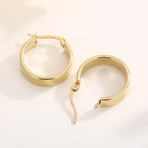 Detailed view of gold stainless steel wide hoop earrings showing secure clasp mechanism