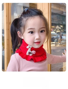Detailed knit texture of red ruffled kids neck warmer with cute handmade deer charm