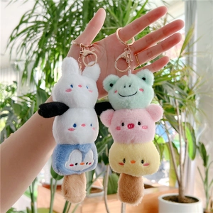 Detail of plush ice cream skewer keychains with cute animal faces and metal rings