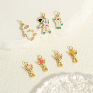 Exquisite 18K gold plated astronaut pendant with enamel and sparkling zircon accents