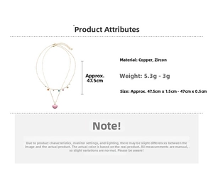 Detail view of pink heart pendant and layered copper chain with colorful zircons