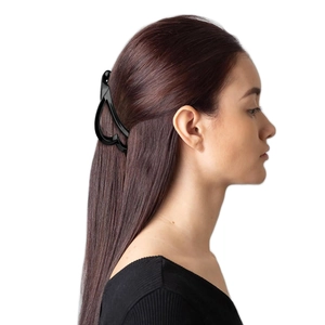 Elegant black hollow heart banana clip for high ponytail on model with side view