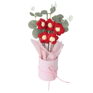 Handmade crochet red flower bouquet in a pink planter pot for home decor and gifts