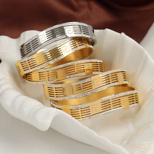 Elegant multi-layered gold and silver titanium steel hollow bangles with crystals