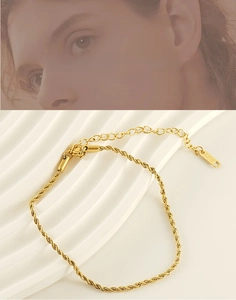Detailed macro of 18k gold plated stainless steel rope chain anklet with lobster clasp