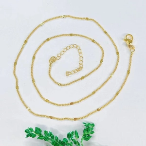 Detail of gold plated heart link chain necklace with lobster clasp and extender chain