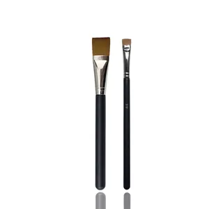 Dual makeup brush set featuring black matte handles and soft brown gradient bristles
