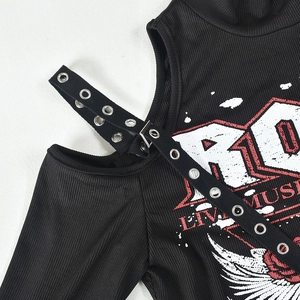 Close-up of black ribbed cold shoulder top with adjustable buckle straps and print