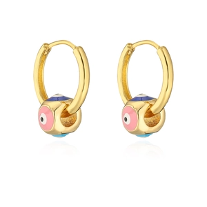 Detail of gold-plated hoop earrings with pink and blue enamel evil eye charms on white