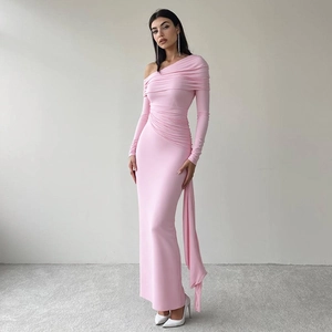 Detailed view of the pink one-shoulder evening dress with elegant side drapes and pleats
