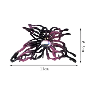 Detail of purple gradient butterfly hair claw with holographic gem, 11cm width