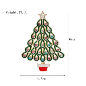 Detail of Christmas tree brooch with green enamel, colorful rhinestones and 6cm dimensions
