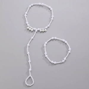 Detail of bohemian pearl anklet with starfish and shell accents for beach vacations