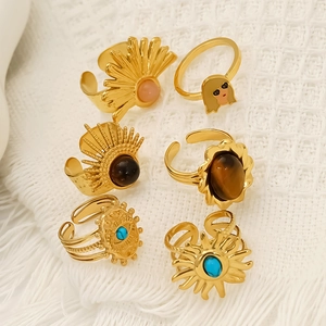 Set of six gold-plated stainless steel rings with turquoise and bohemian style elements