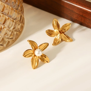 Detailed view of 18k gold stainless steel flower earrings with a white pearl accent