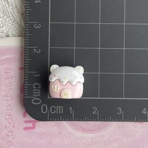 Detailed view of mini resin candy house charm with scale showing 1.5cm size for DIY crafts
