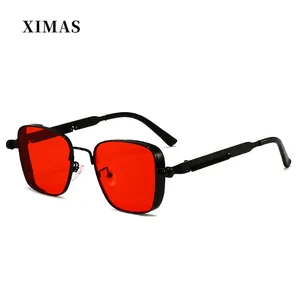 Detail view of steampunk square metal frame with red lenses and textured temples