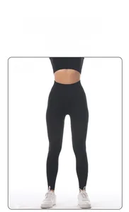 Macro detail of high-waist black seamless yoga leggings with ribbed texture fabric
