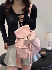 Stylish pink nylon backpack for women with buckle closure and multiple pockets