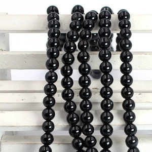 Close-up of polished black agate round beads 8mm to 10mm for DIY jewelry making