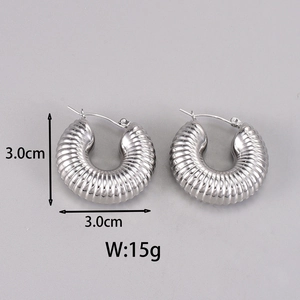 Detail view of silver hollow crescent earrings with spiral texture and 3.0cm size