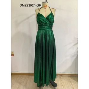 Detail of emerald green metallic fabric with ruched waist and deep V-neckline