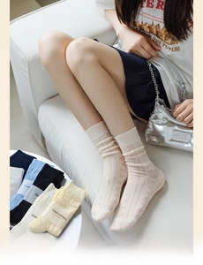 Detail of knit bow pattern and hollowed-out texture on sweet cotton crew socks